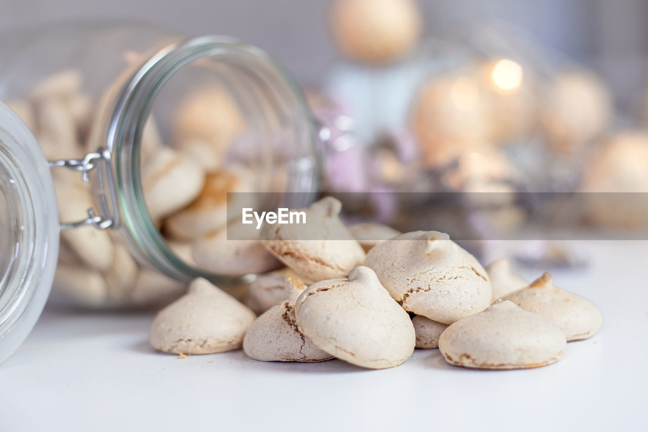 CLOSE-UP OF GARLIC ON GLASS TABLE
