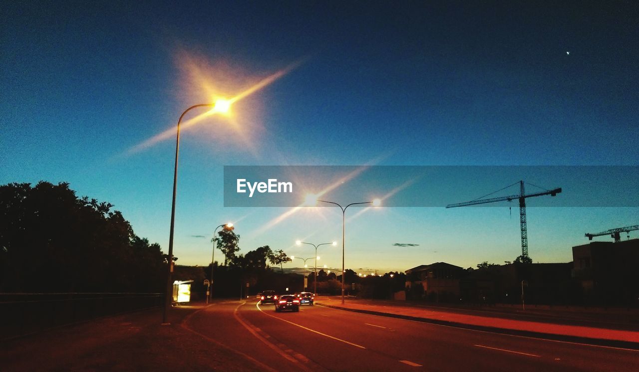 ROAD AGAINST SKY AT NIGHT