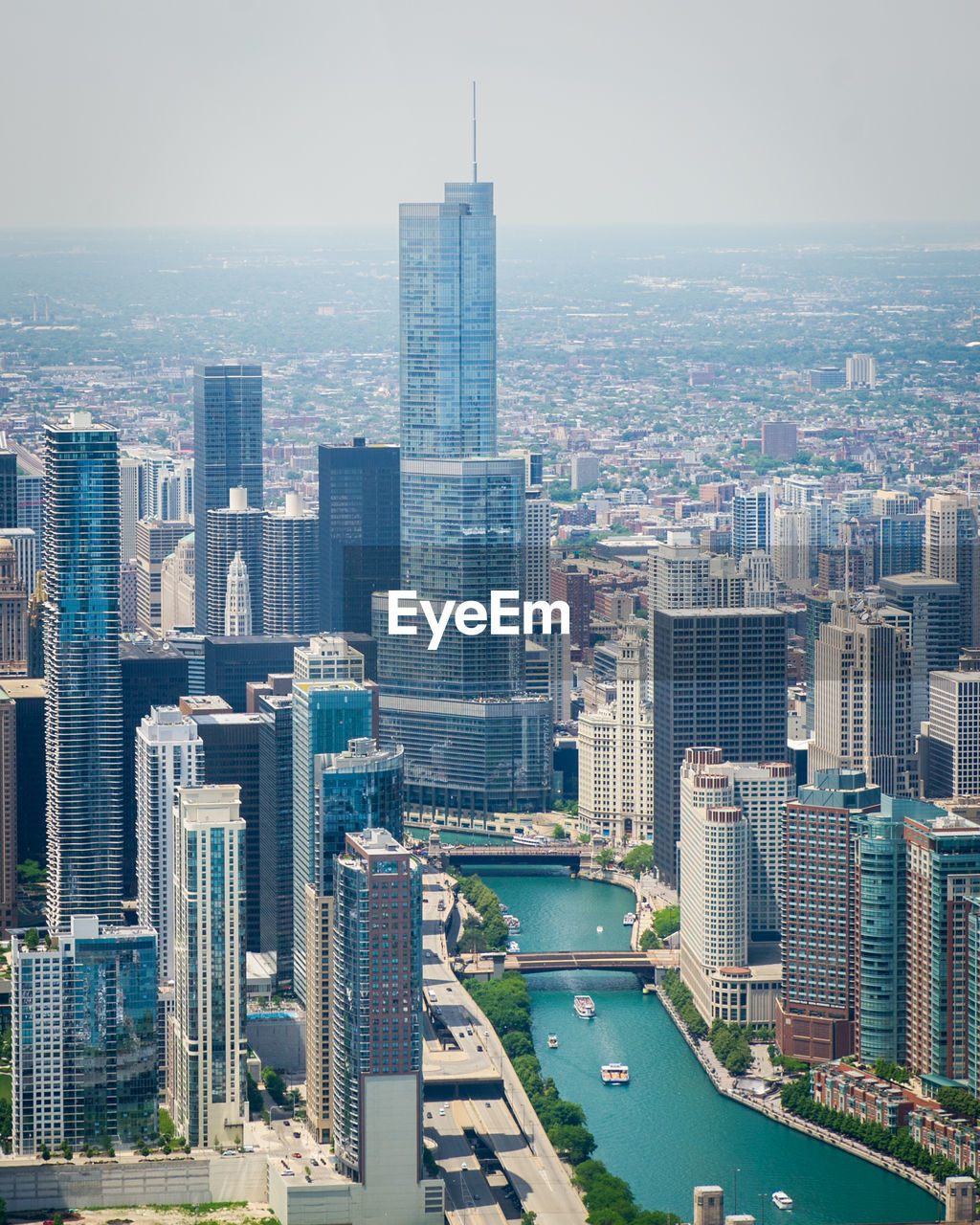 High angle view of buildings in city against sky trump building