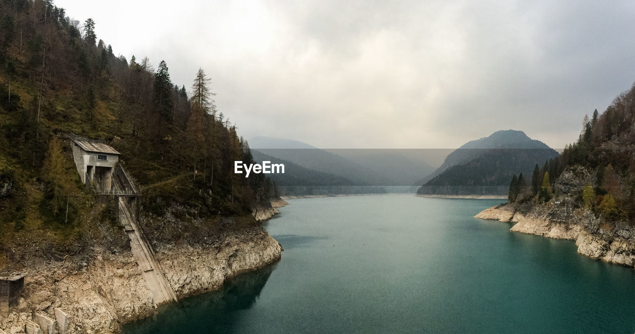 Scenic view of river amidst mountains