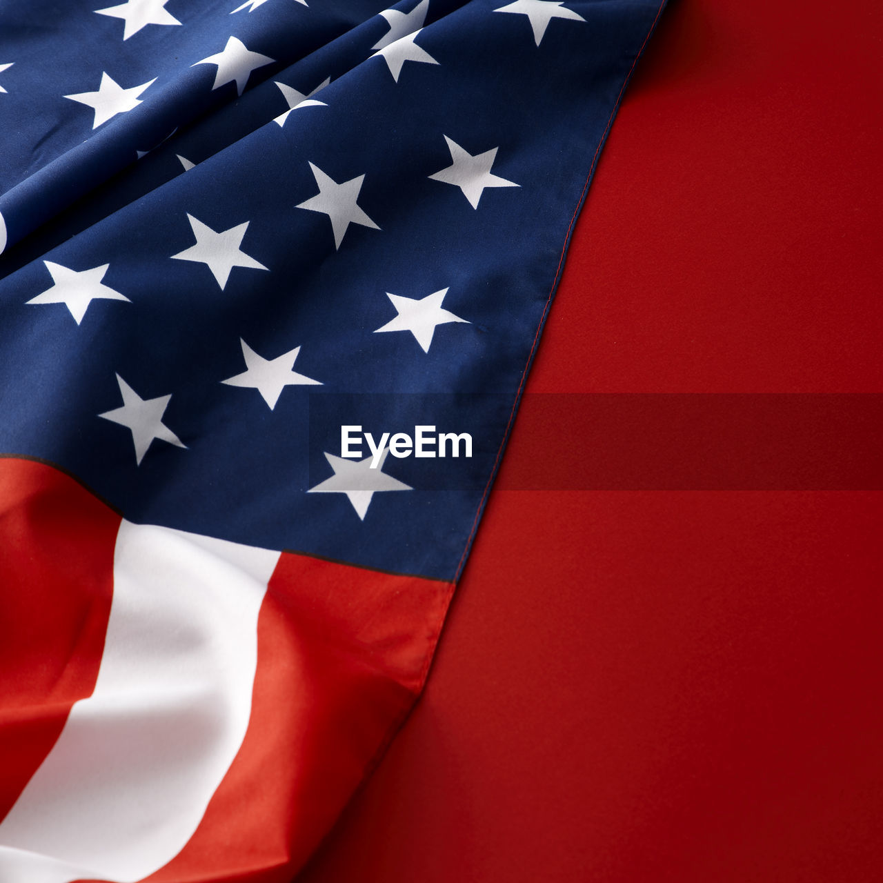 FULL FRAME SHOT OF FLAGS WITH RED UMBRELLA