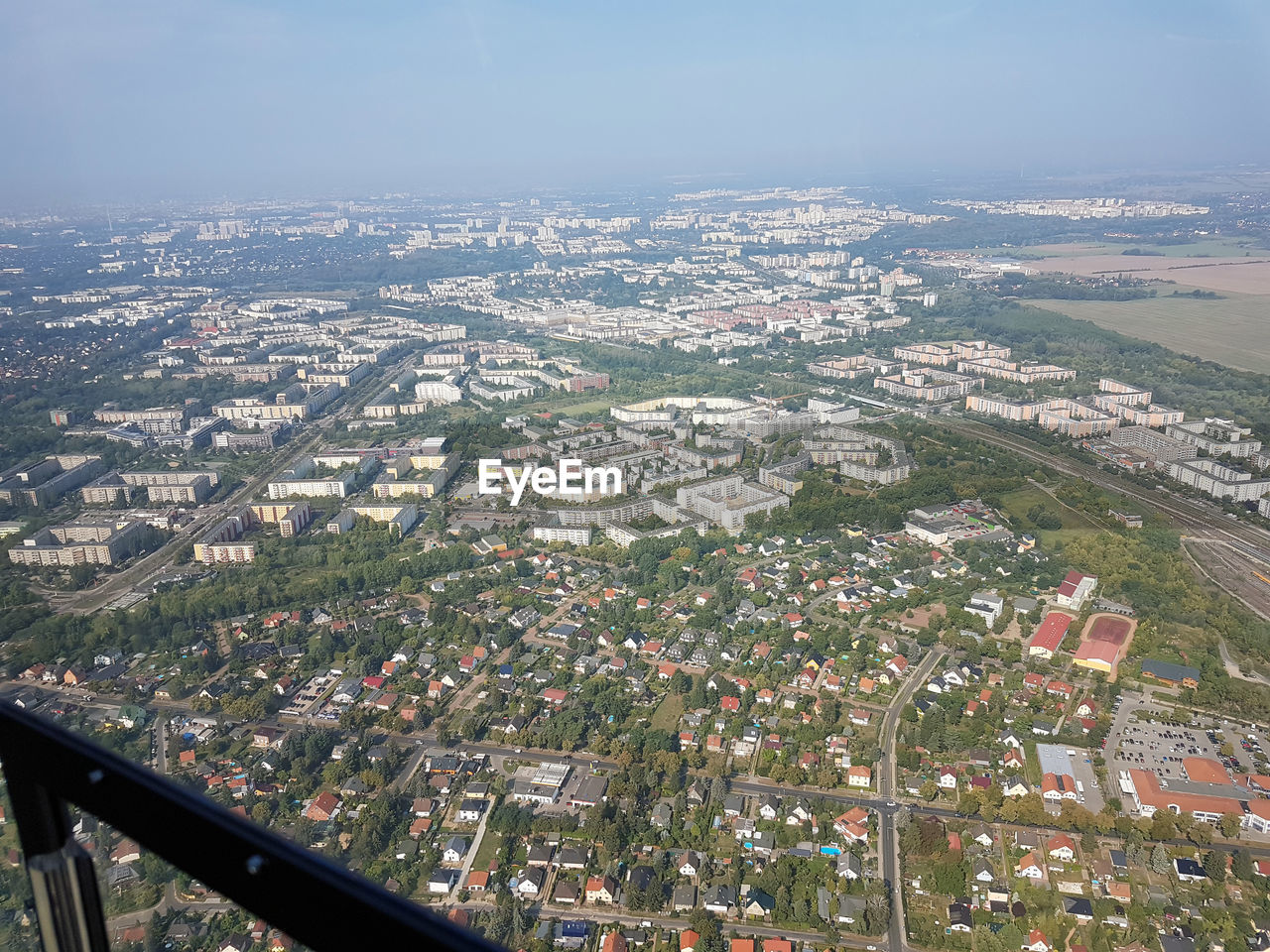 HIGH ANGLE VIEW OF BUILDINGS AGAINST SKY