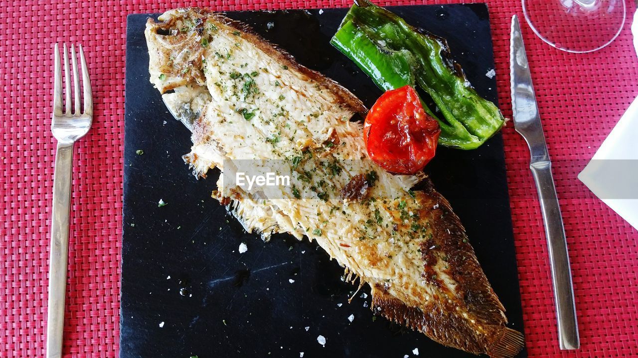 Close-up of fish on slate at table