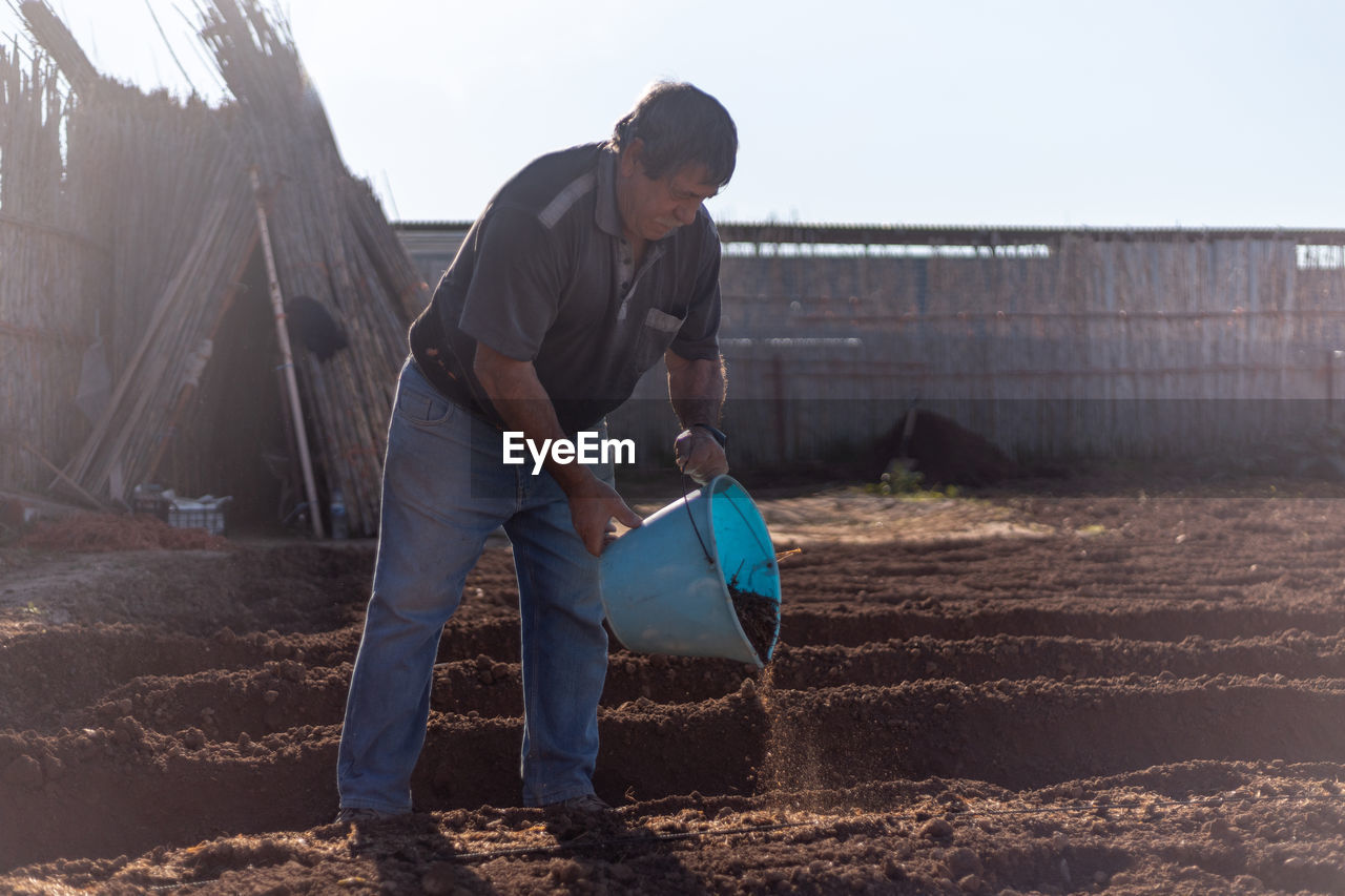 Full length of man working at farm