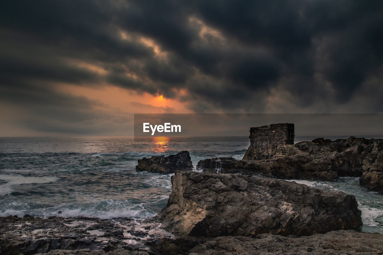 Scenic view of sea against sky during sunset