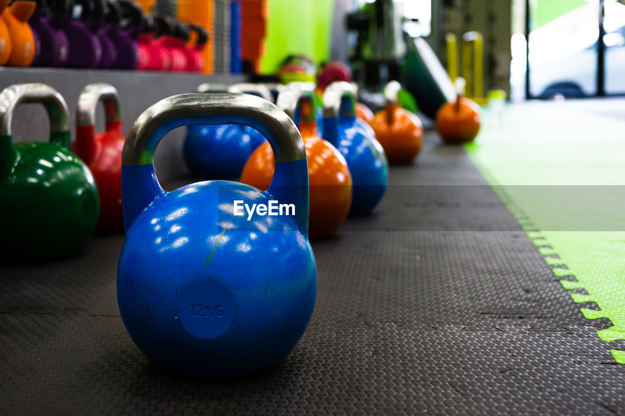 CLOSE-UP OF MULTI COLORED BALLS IN ROW