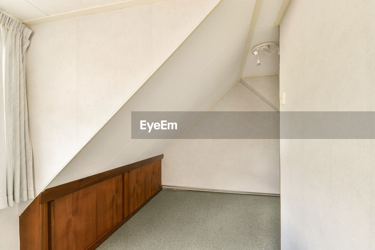 architecture, indoors, built structure, home interior, interior design, no people, building, staircase, room, floor, house, luxury, wealth, wall - building feature, sparse, white, home, steps and staircases, home showcase interior, wall, stairs, simplicity, copy space