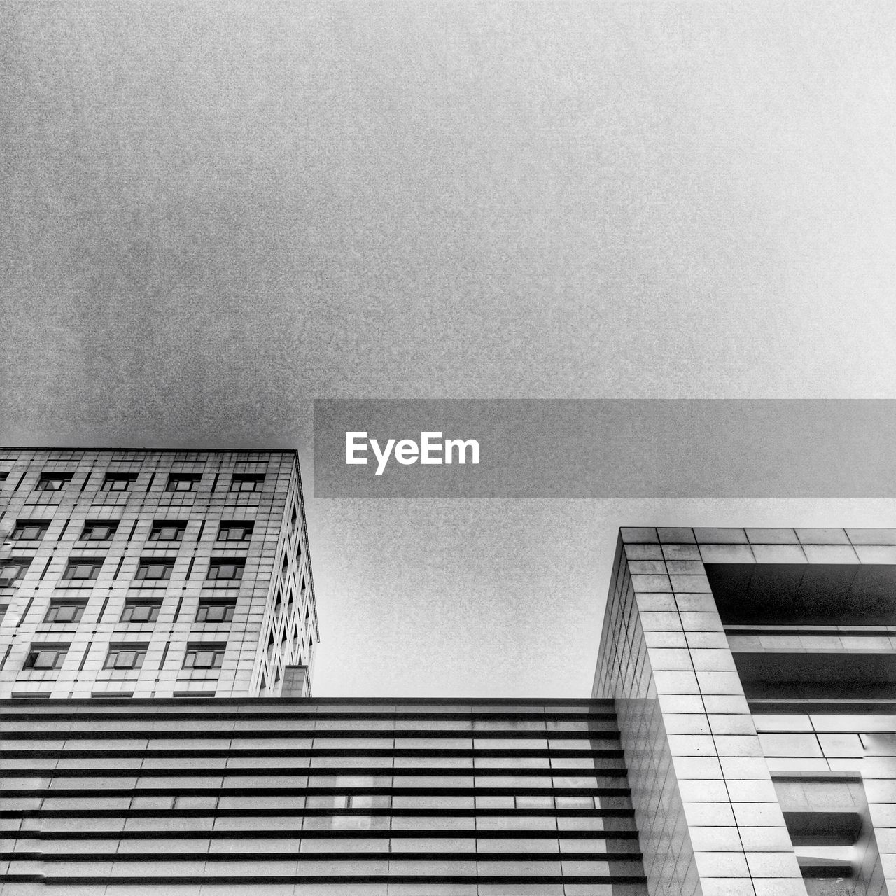 LOW ANGLE VIEW OF MODERN BUILDINGS AGAINST SKY