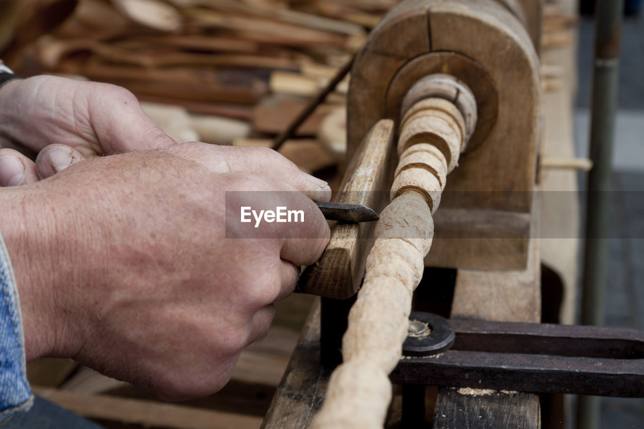 LOW SECTION OF MAN WORKING ON WOOD