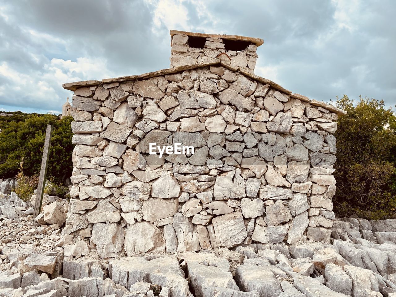 rock, cloud, ruins, architecture, sky, ancient history, nature, history, wall, built structure, archaeological site, stone wall, stone material, the past, building exterior, no people, environment, landscape, land, building, ancient, outdoors, travel destinations, travel, stone, old ruin, plant, tree, house, construction industry, scenics - nature, industry, temple, old, day, fort, wall - building feature, tourism, surrounding wall