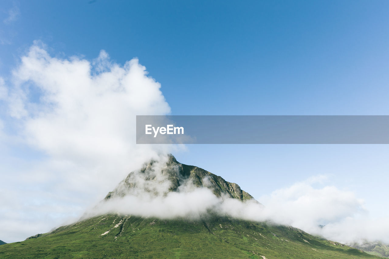 Low angle view of majestic mountain against sky