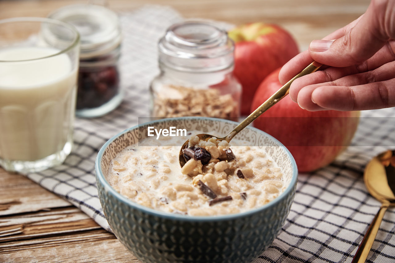 Morning breakfast with granola on wooden background