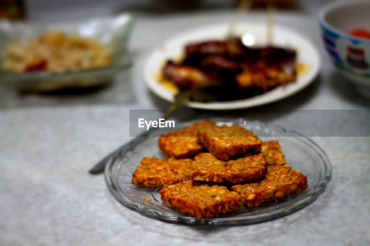 Close-up of food in plates on table