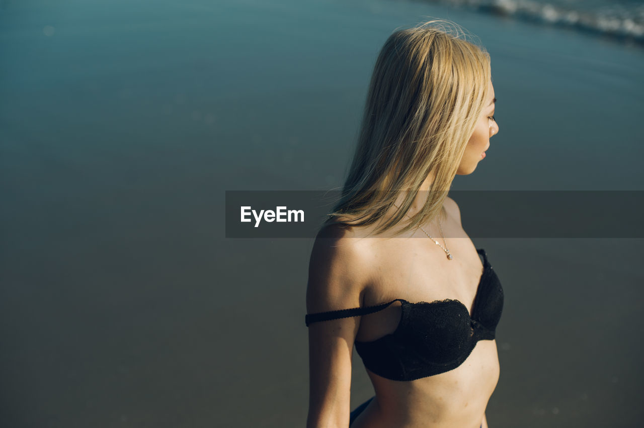 Young fashion model at beach