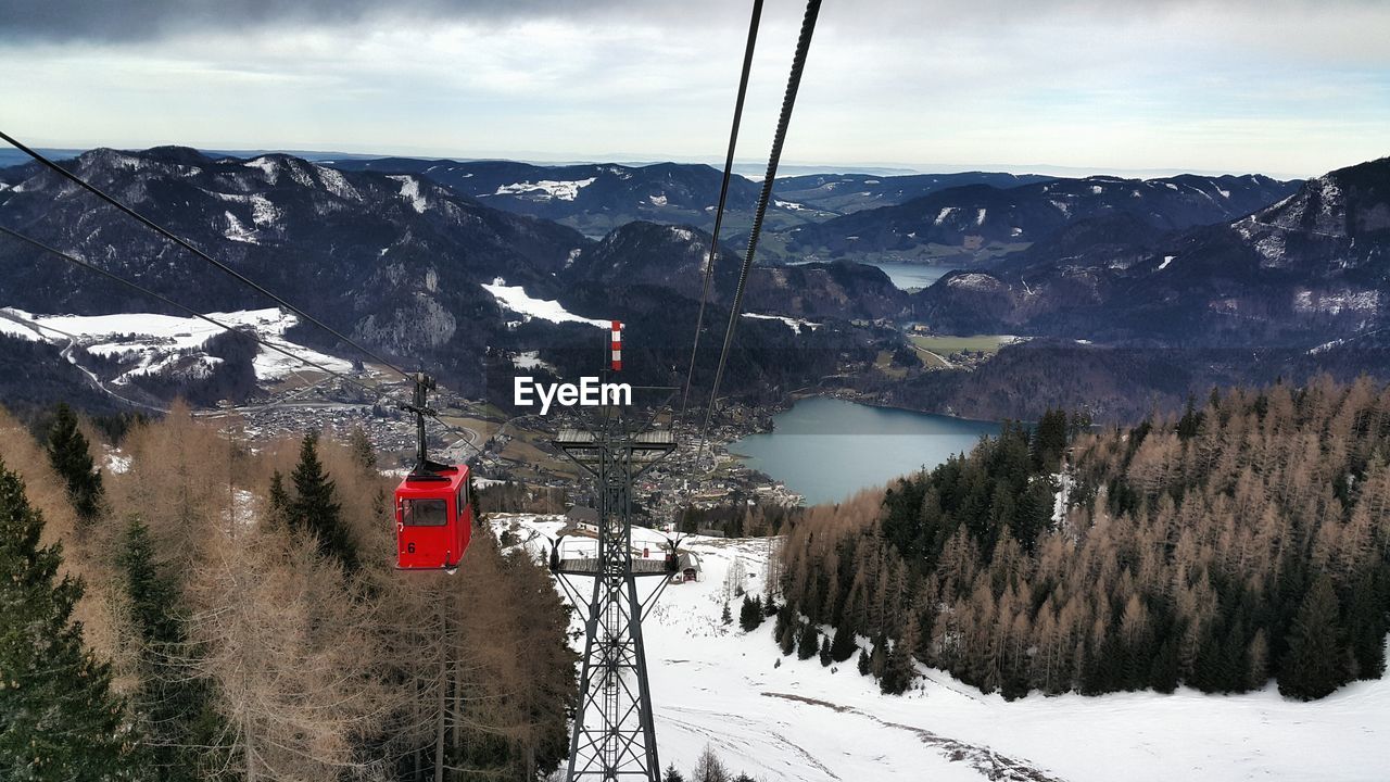 Overhead cable car at snow covered mountain