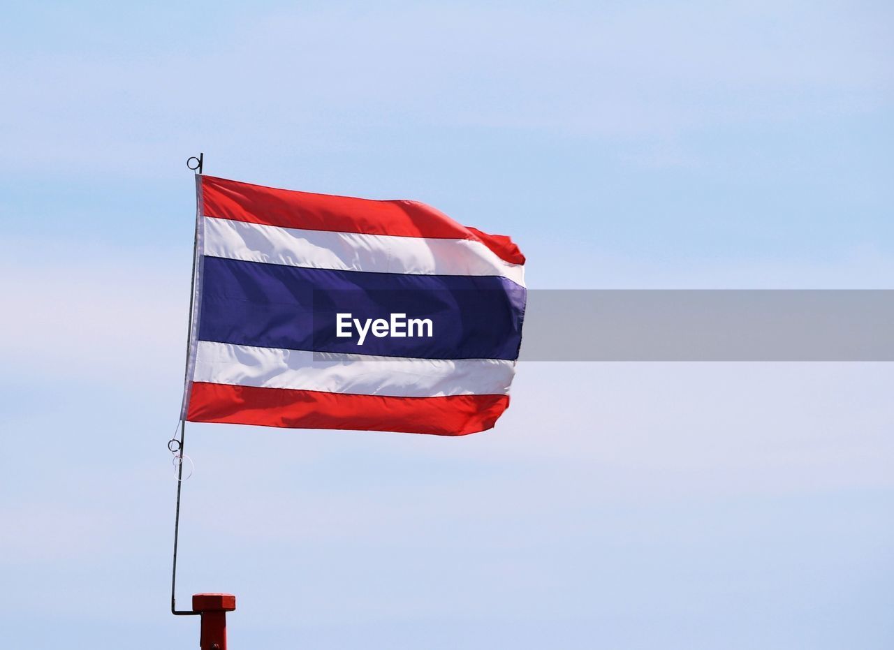 flag, patriotism, red, sky, environment, nature, wind, blue, no people, low angle view, pole, day, outdoors, symbol, striped, morning, copy space