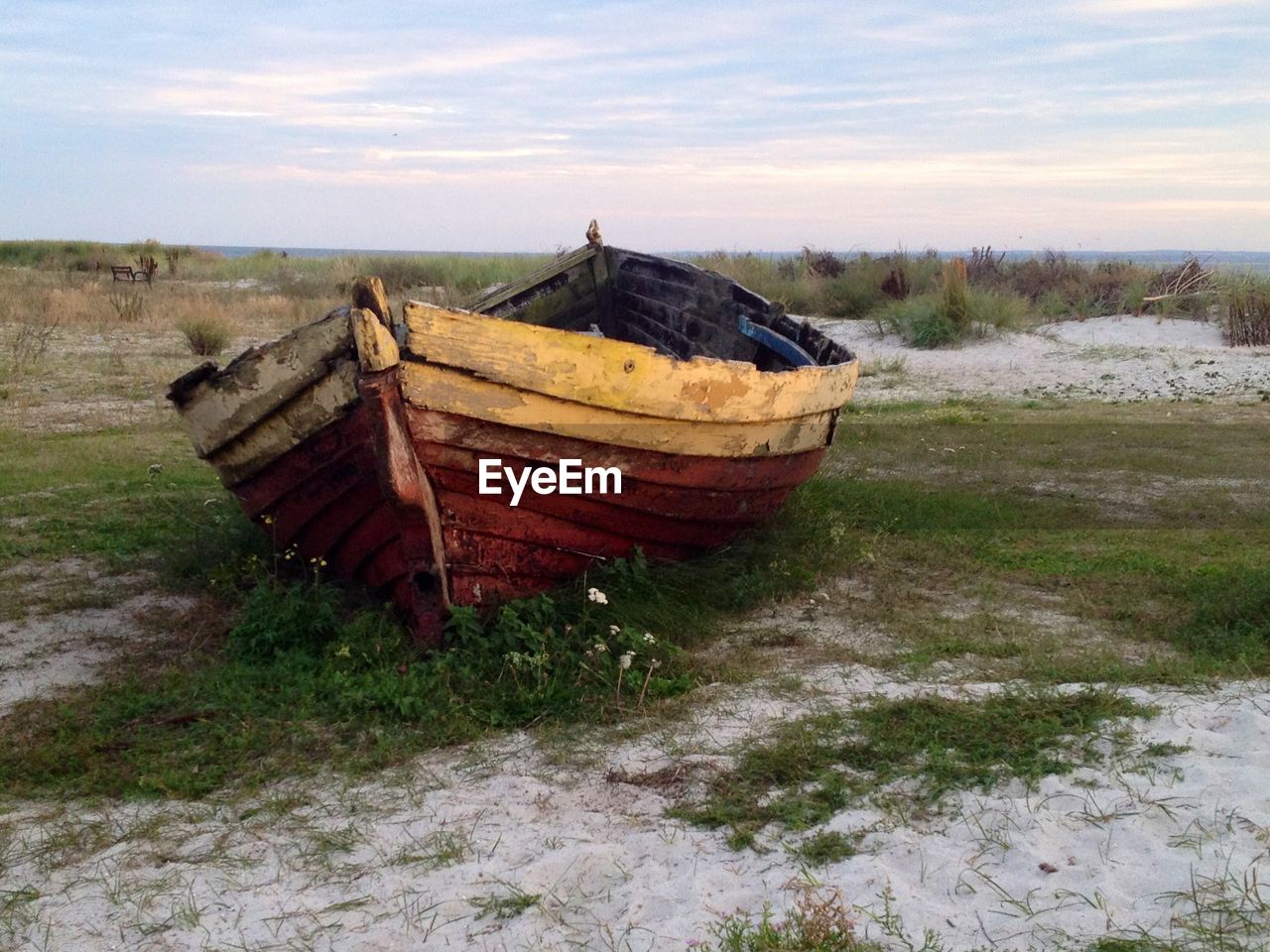 ABANDONED BOAT ON SHORE