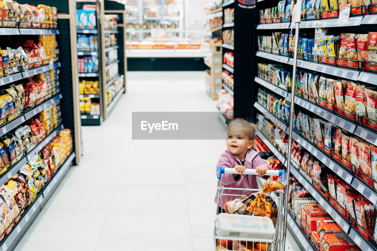 WOMAN LOOKING AT STORE