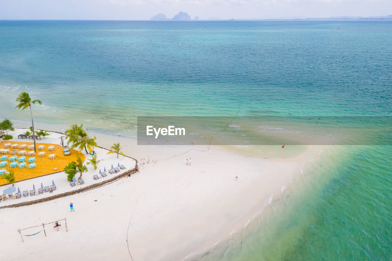 high angle view of people swimming in sea