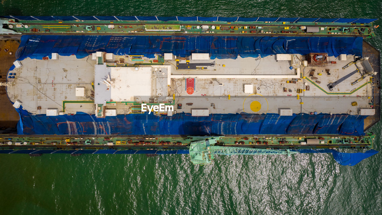 Aerial view of a shipyard repairing a large ship in thailand.