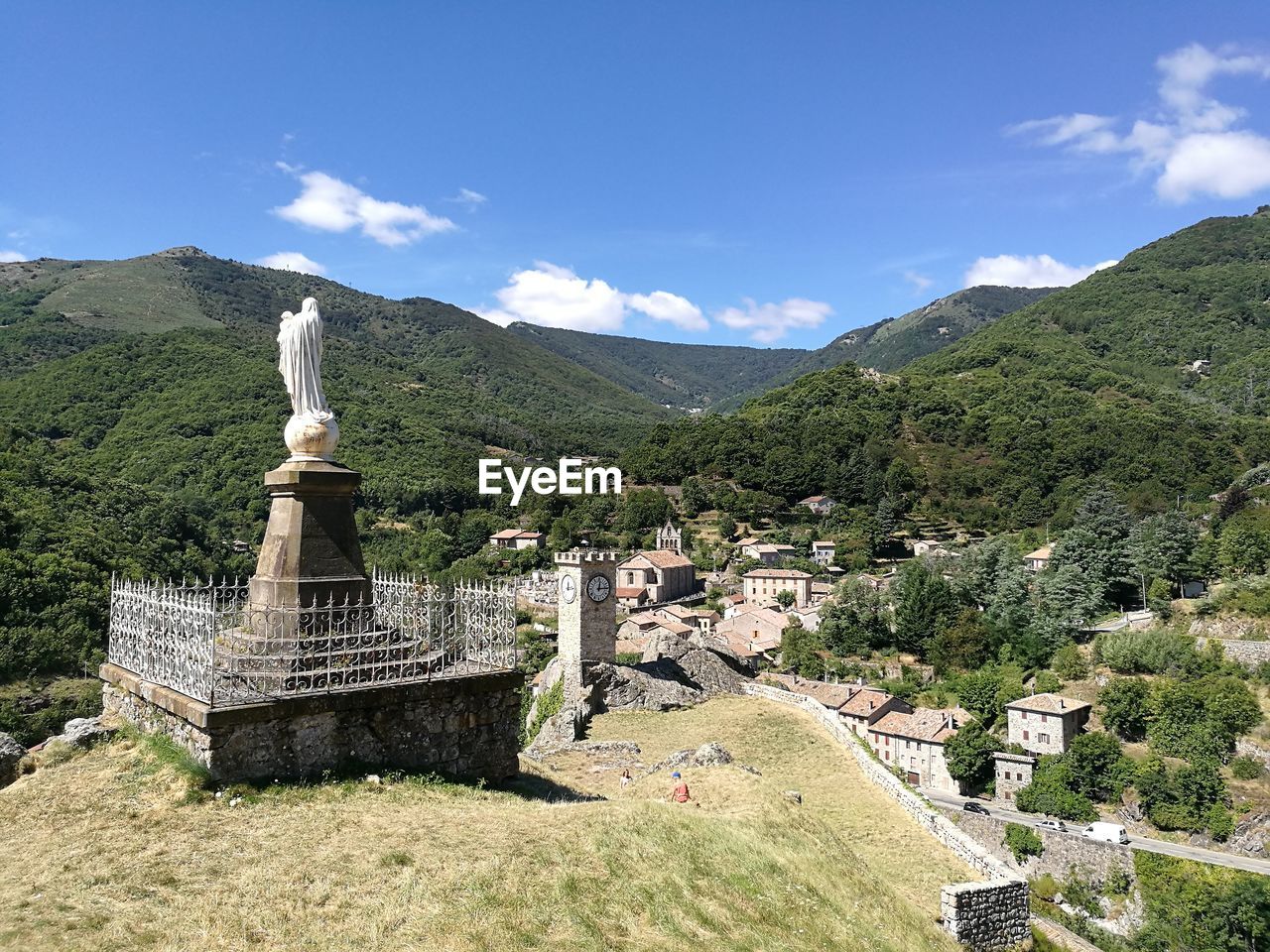 Monument by mountains against sky