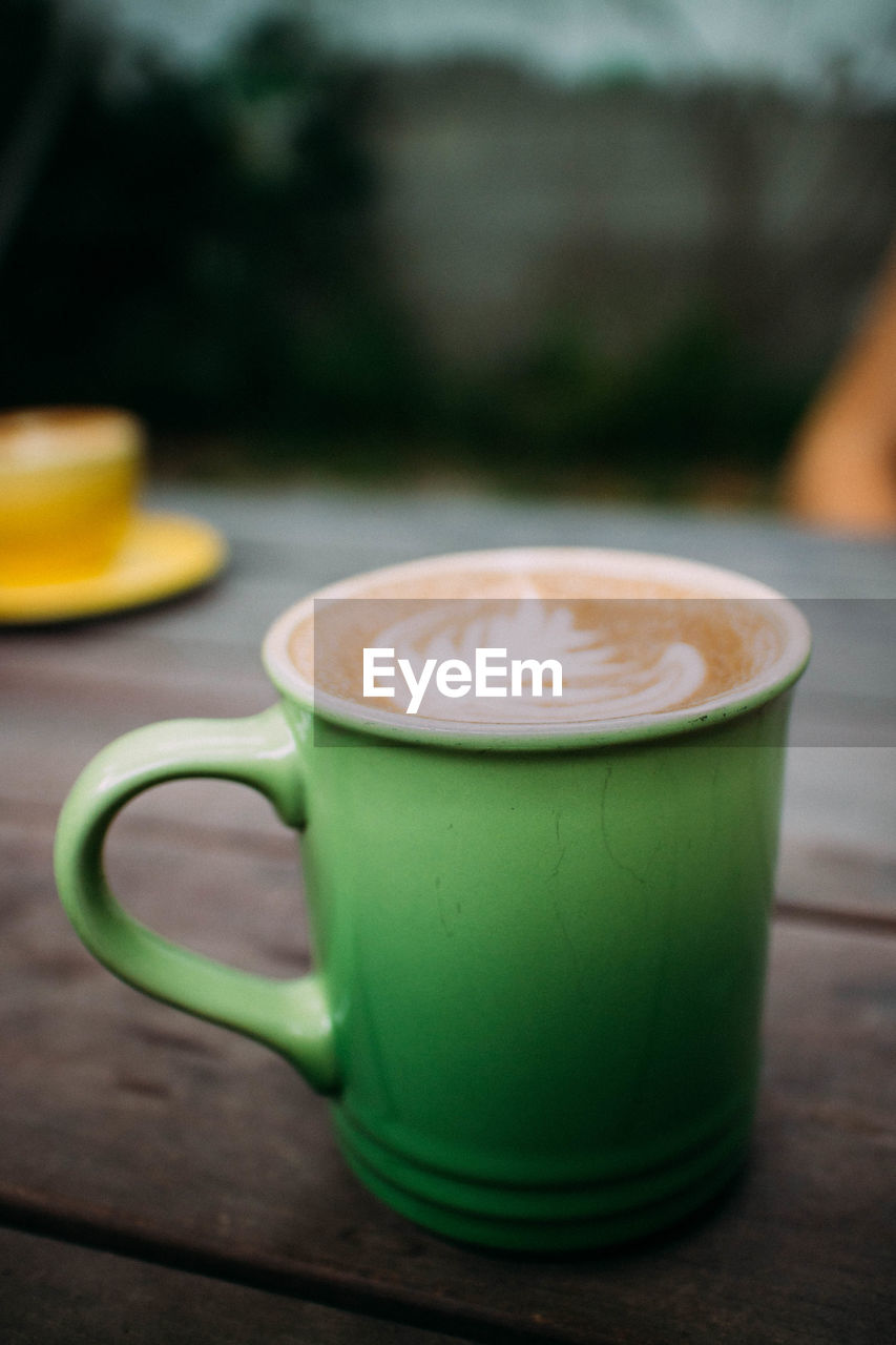 Close-up of coffee cup on table