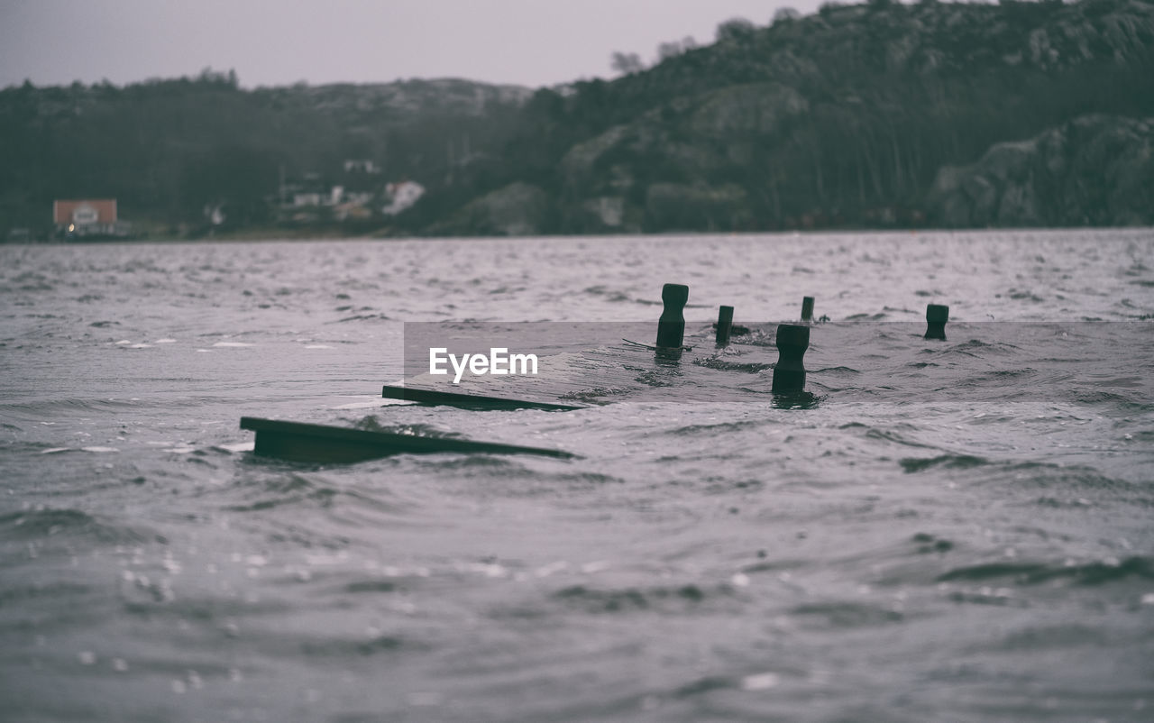 Wooden furniture floating in river