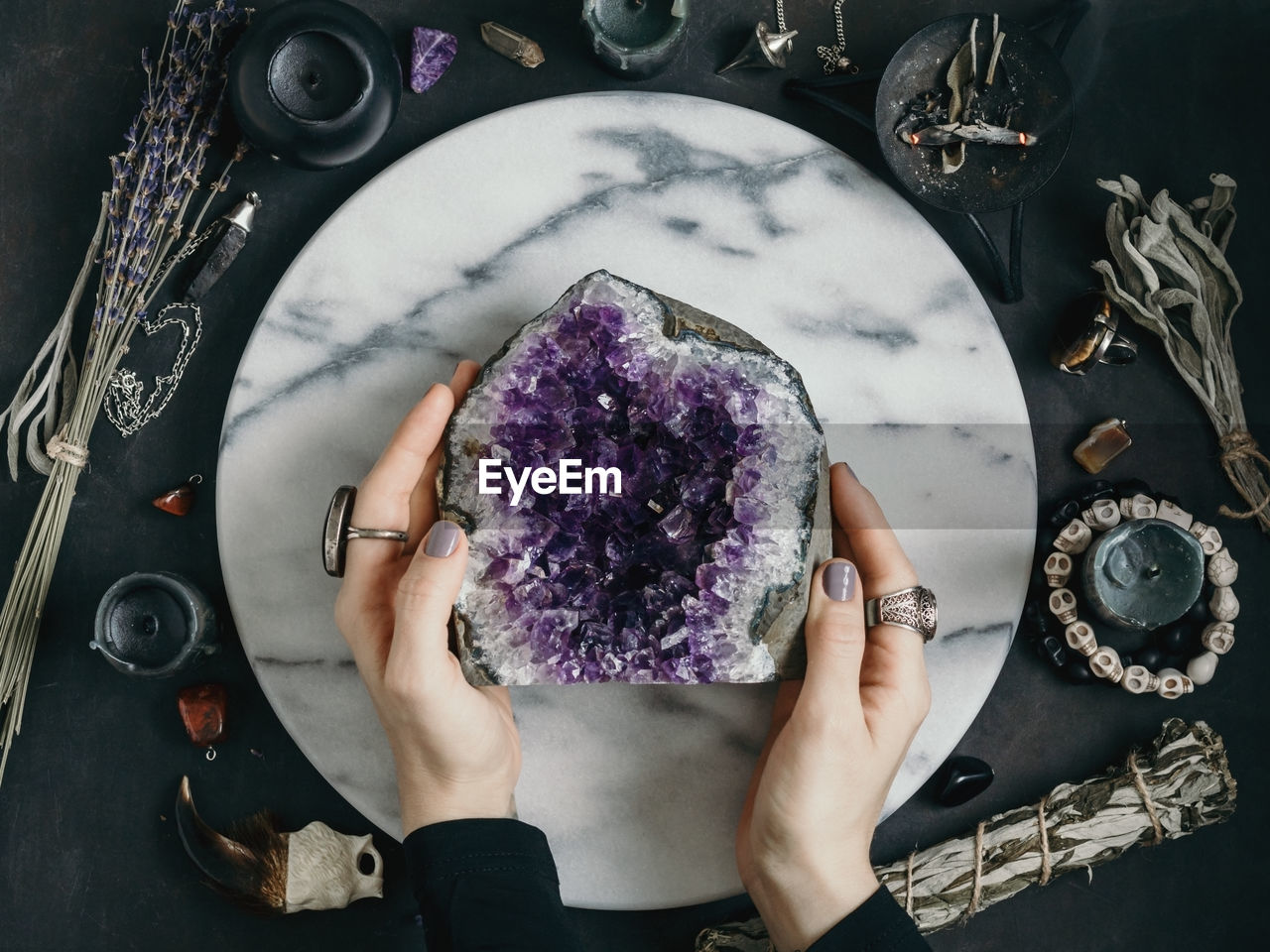 Portrait of woman looking through magnifying glass