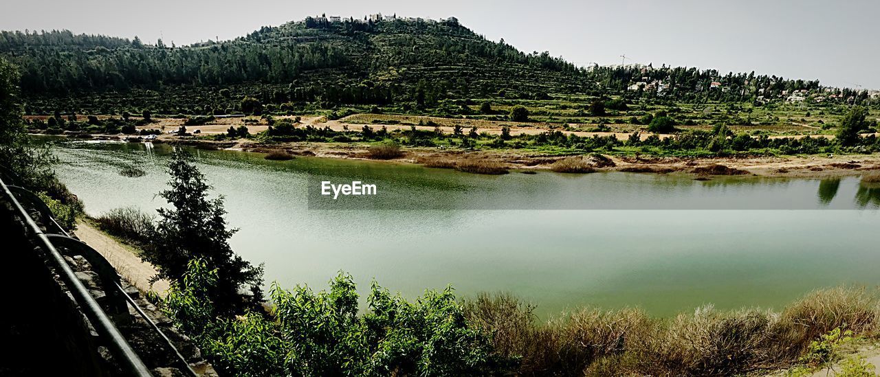 SCENIC VIEW OF LAKE AGAINST TREES