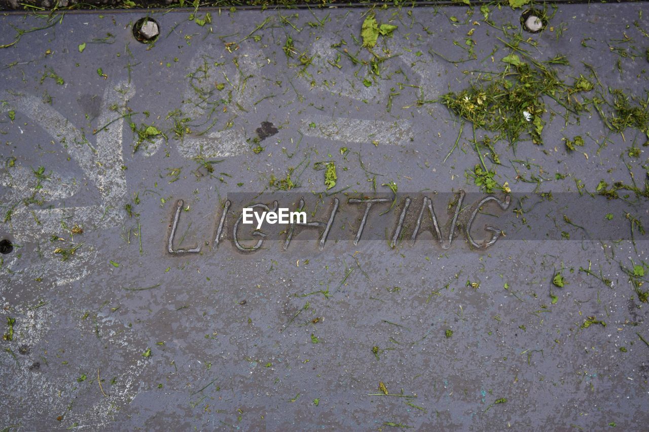 CLOSE-UP VIEW OF TEXT ON WALL