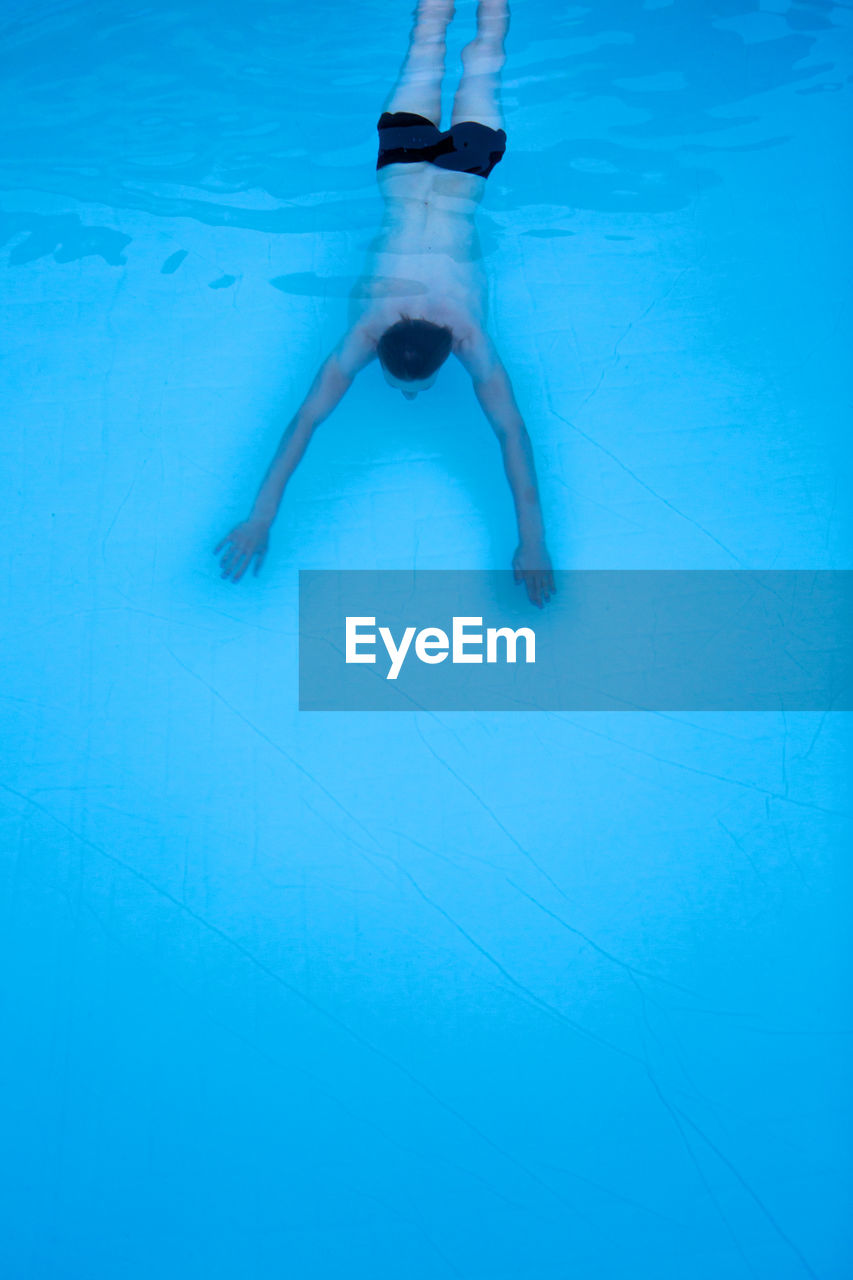 High angle view of man in swimming pool