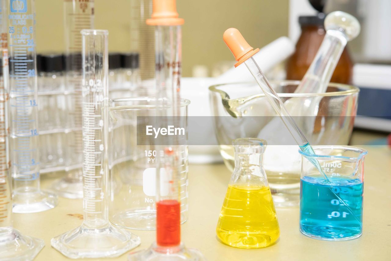 Close-up of chemicals in containers on table