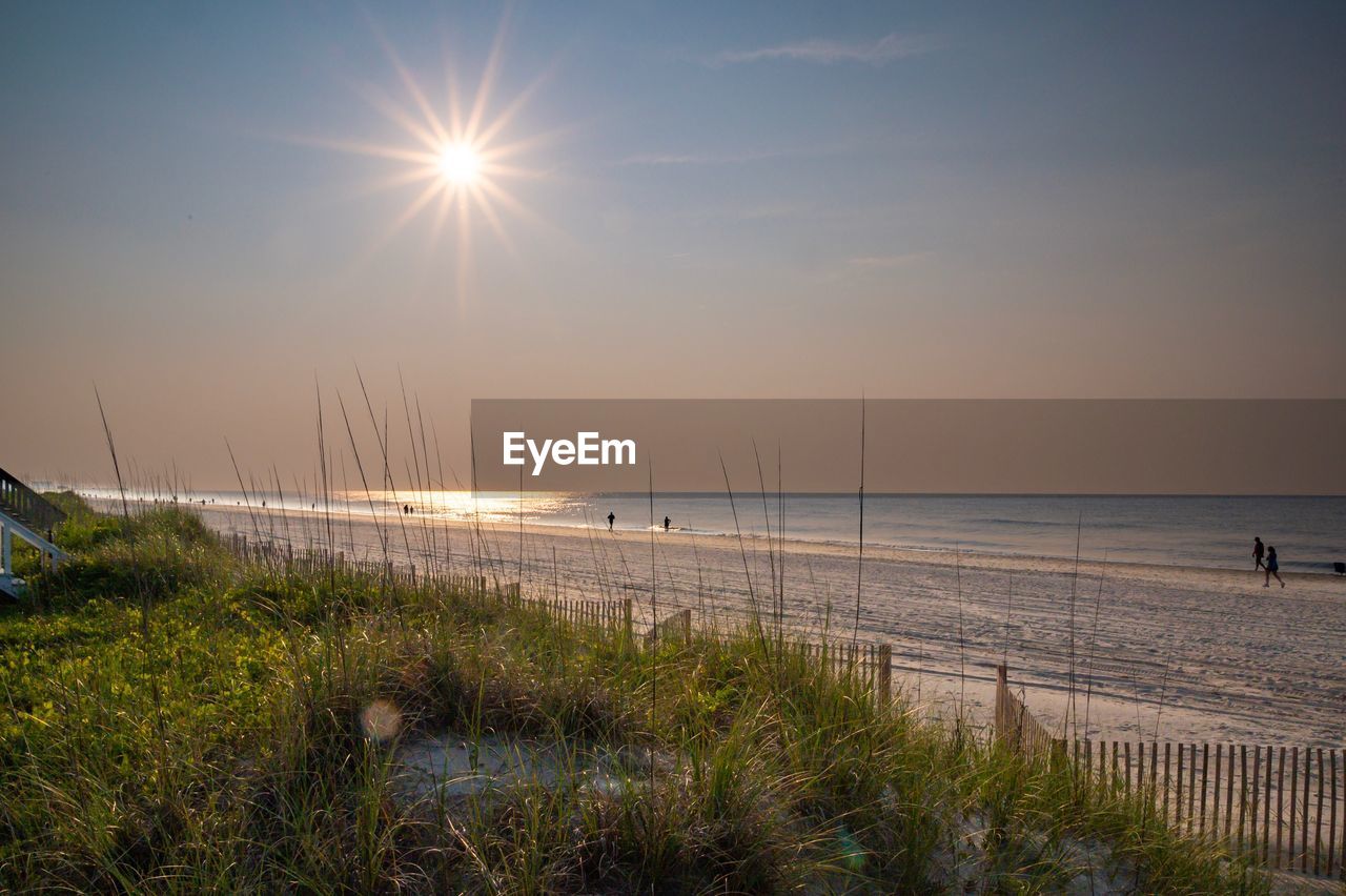 Sunrise over myrtle beach, north carolina with dunes and sand