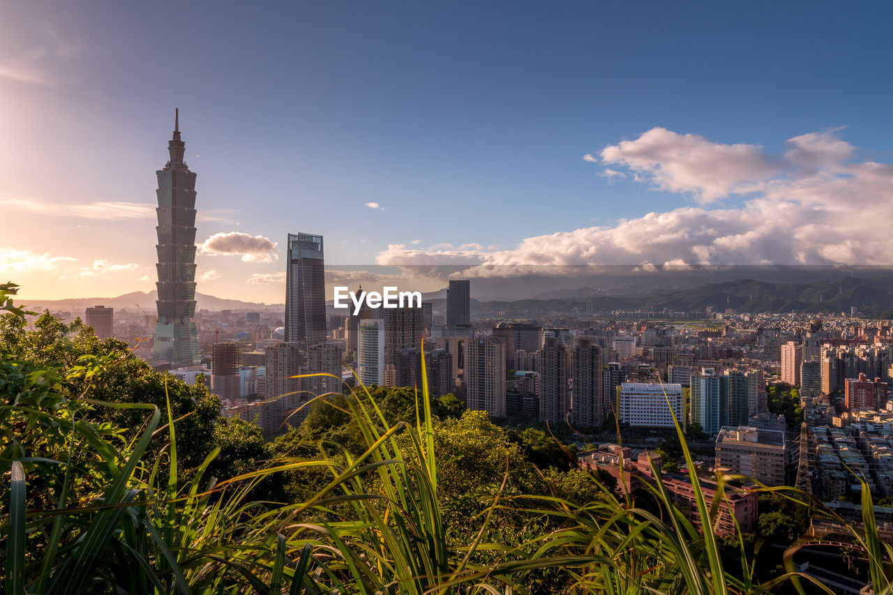 MODERN BUILDINGS IN CITY AGAINST SKY