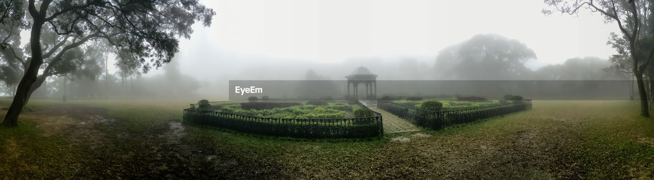 Panoramic view of gazebo at park during foggy weather