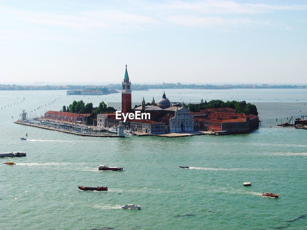 Venice sailboats in sea against buildings