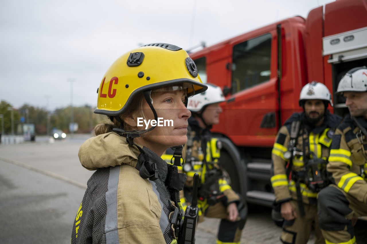 Female firefighter looking away