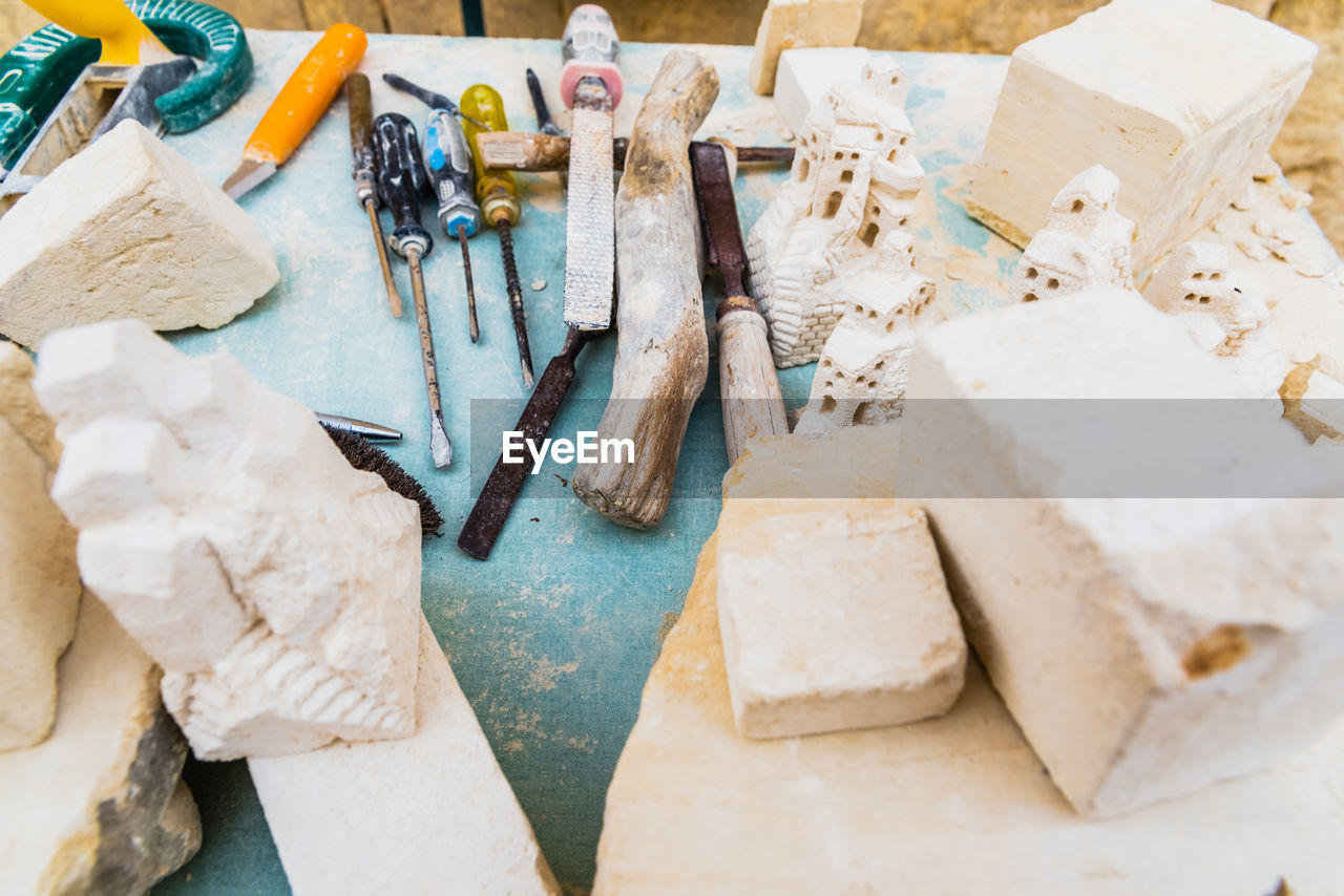 HIGH ANGLE VIEW OF MESSY TABLE AND CHAIRS