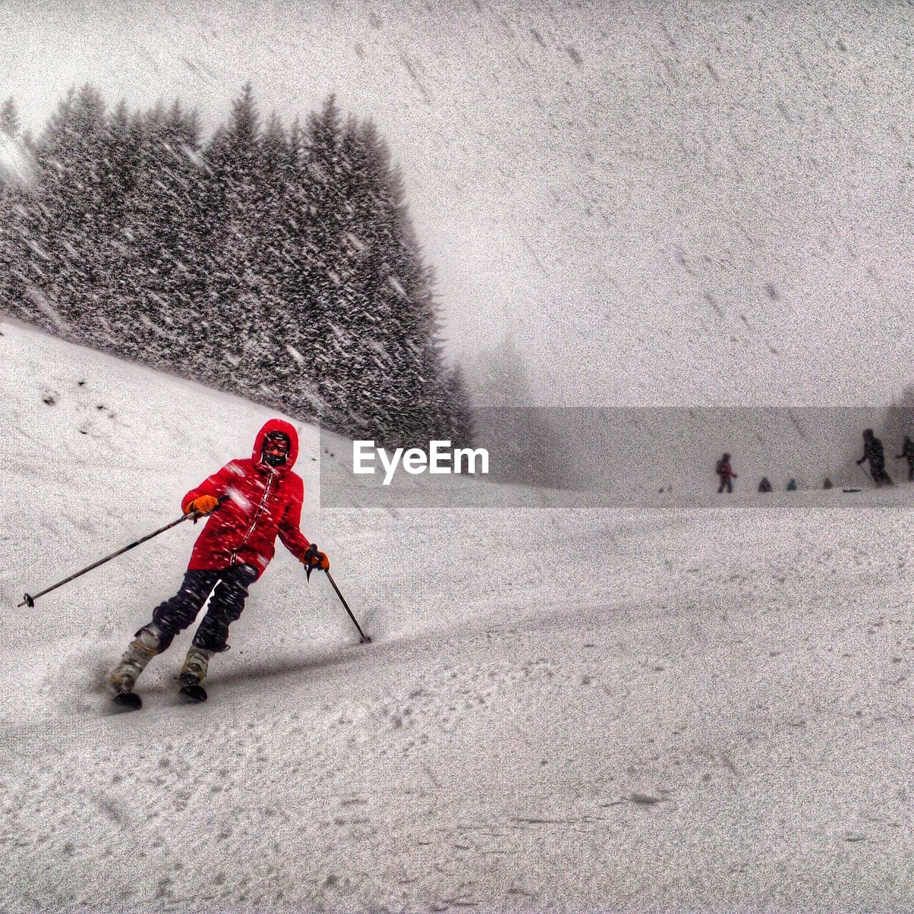 HIGH ANGLE VIEW OF PERSON SKIING ON SNOW IN WINTER