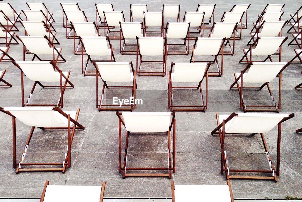 High angle view of empty chairs in rows