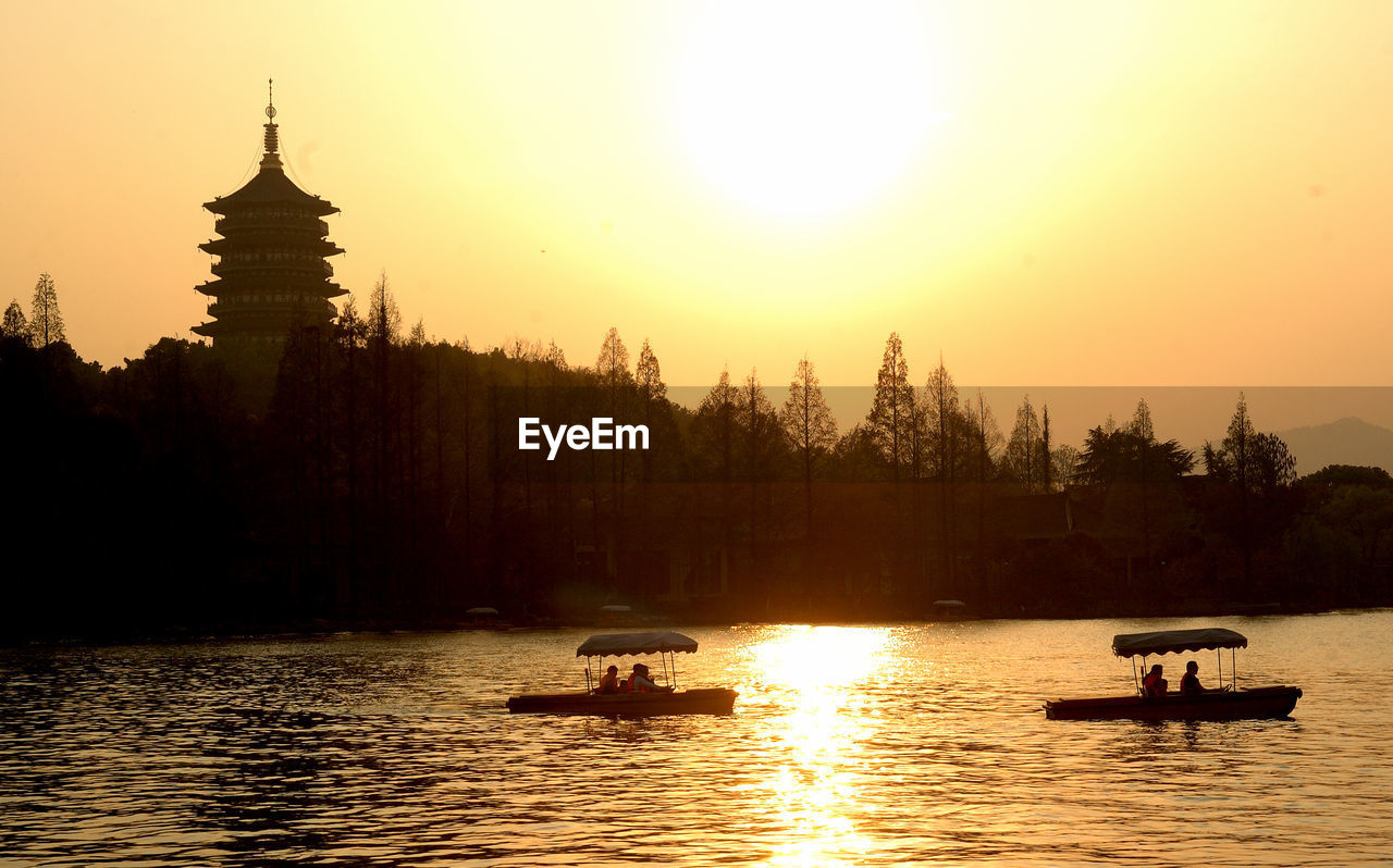 Scenic view of lake against sky during sunset