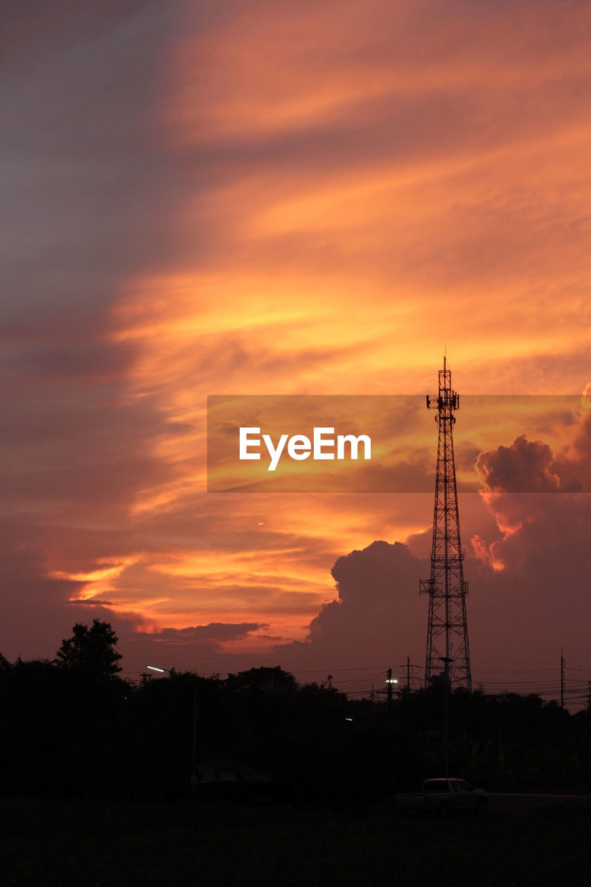 sky, sunset, cloud, silhouette, technology, afterglow, nature, orange color, architecture, tower, horizon, communications tower, no people, environment, built structure, beauty in nature, dawn, power generation, landscape, scenics - nature, dramatic sky, industry, outdoors, evening, red sky at morning, communication, broadcasting, electricity, business finance and industry, tree, electricity pylon, tranquility