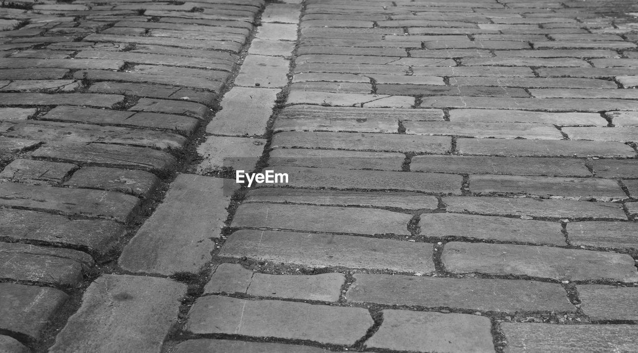 Old cobblestones down an old backalley in portsmouth united kingdom.