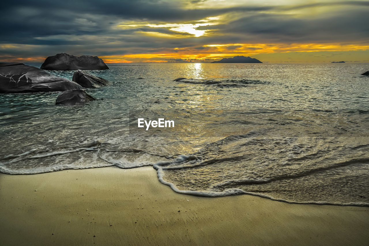 Scenic view of sea against sky during sunset