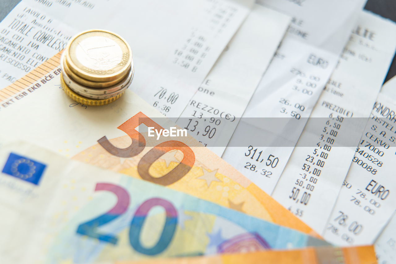 High angle view of coins on table