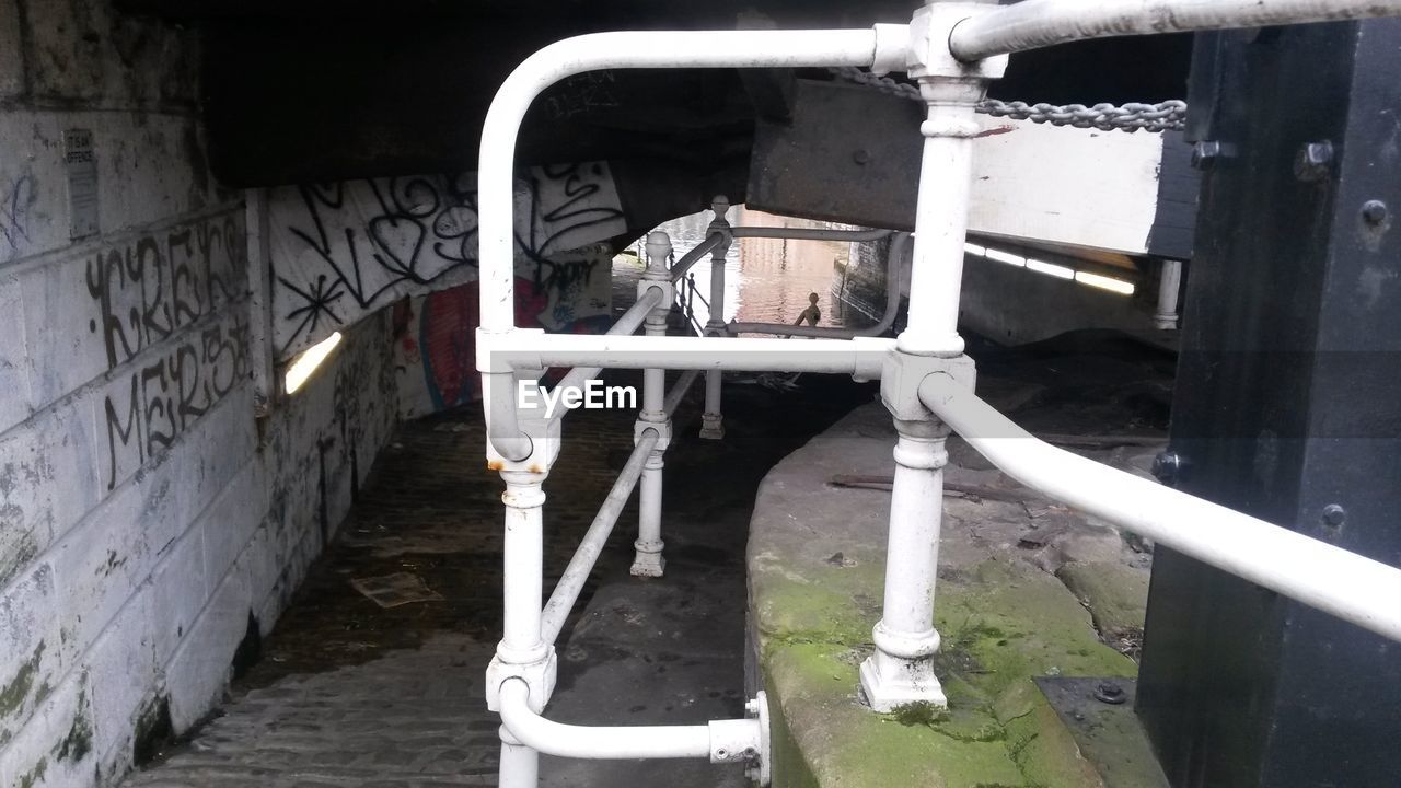 White metallic railing in tunnel