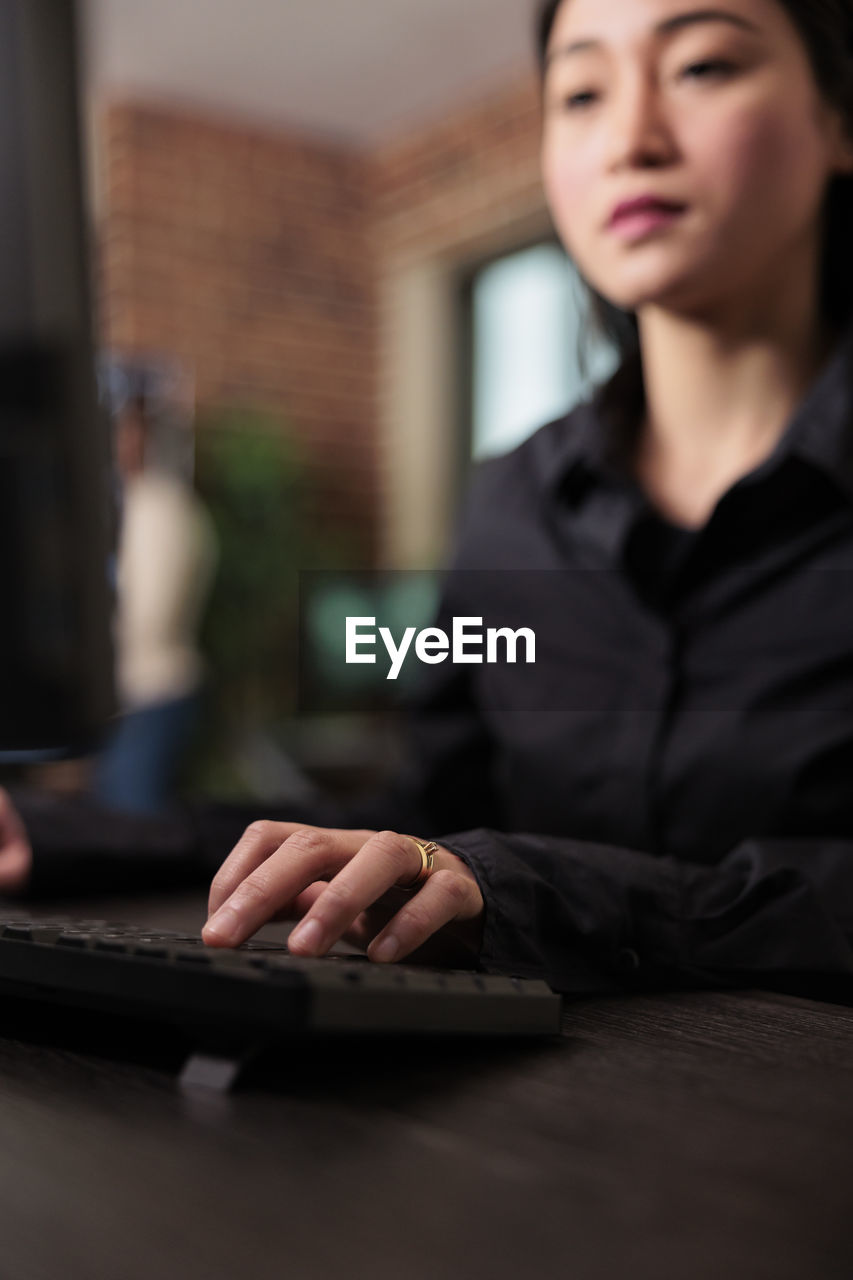 close-up of woman using laptop