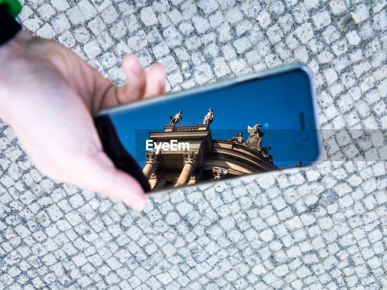 Reflection of berlin cathedral in smart phone