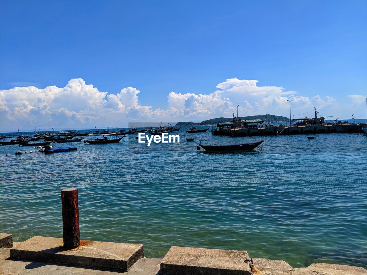 Scenic view of sea against blue sky