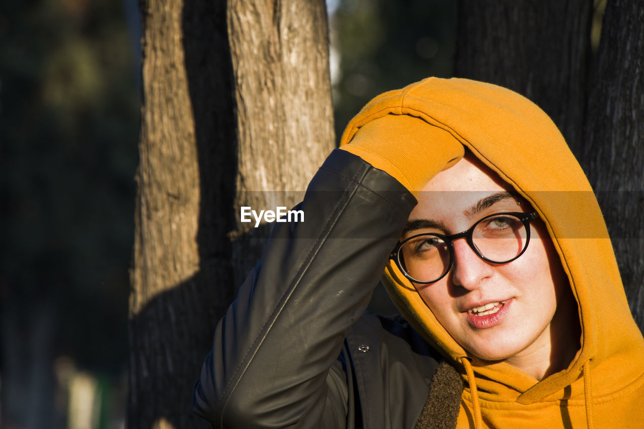 Young adult woman portrait at sunset in the park, tbilisi, georgia